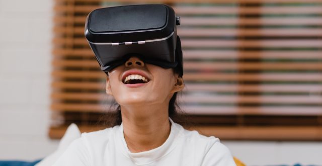Asian teenager woman using glasses virtual reality simulator pla ANIMATIONS & FLY-THROUGHS
